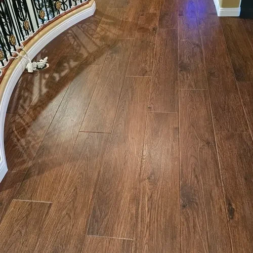 Dark hardwood flooring curving through a Las Vegas living space, an Affordable Flooring job