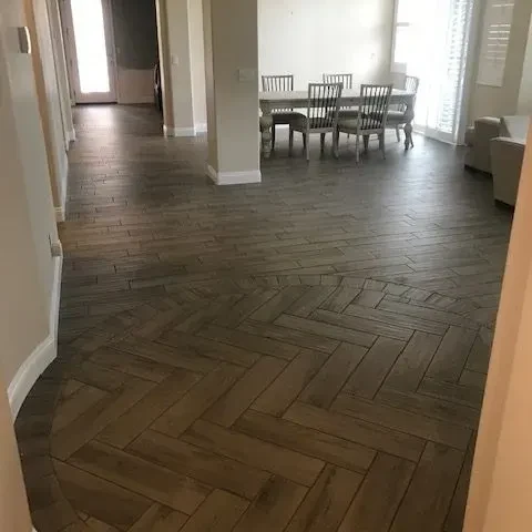 Dark wood floor laid in a herringbone pattern